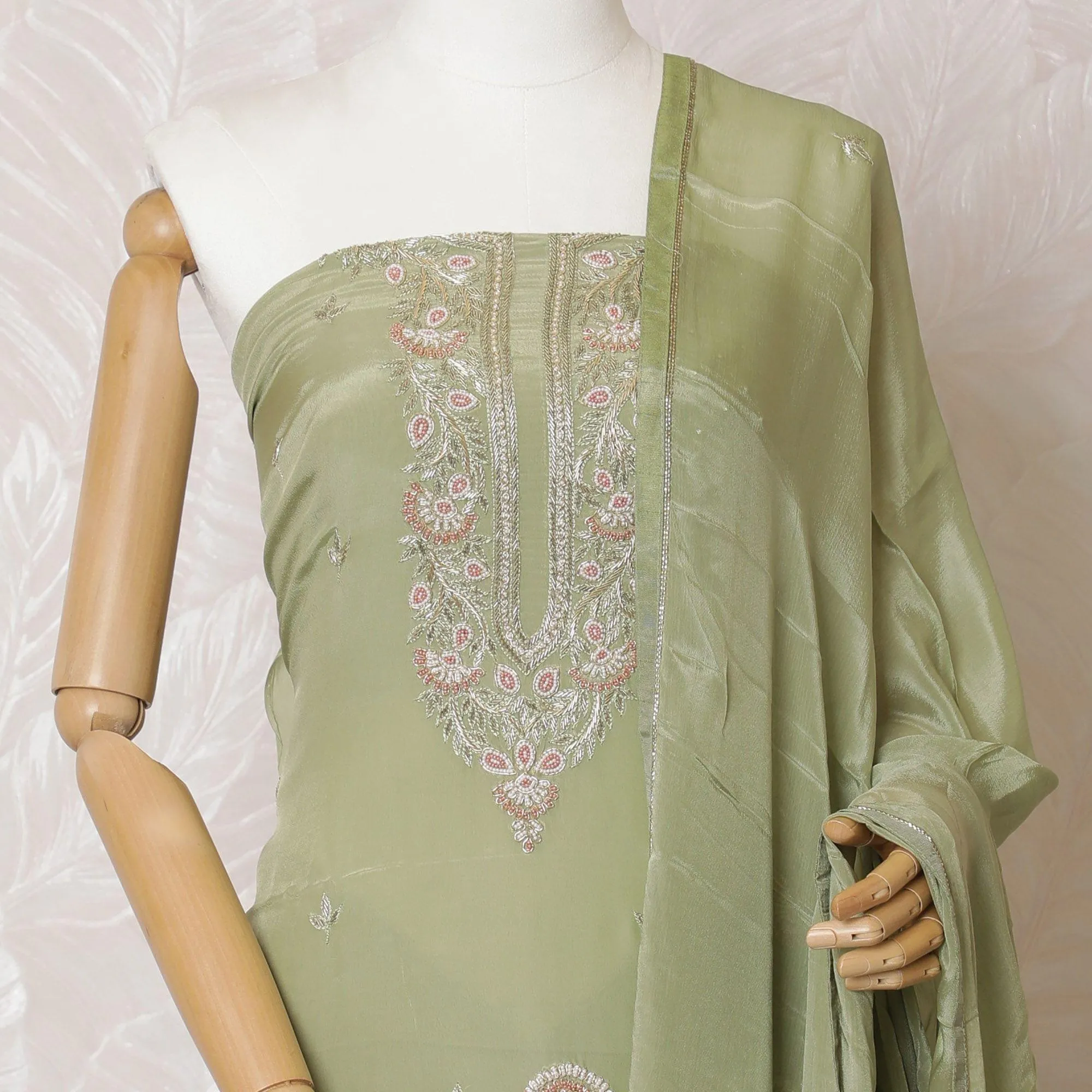 Sage green Premium pure silk crepe kameez with same tone embroidery and bead work in floral design. Sage green Plain salwar with same tone chiffon dupatta having same tone embroidery and stone work-D15571