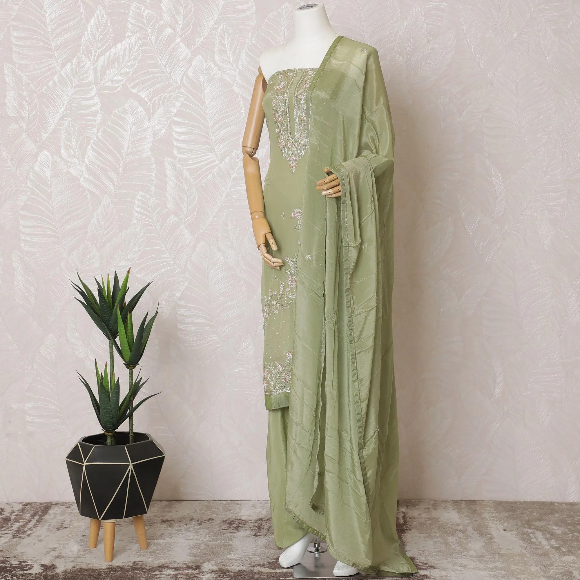 Sage green Premium pure silk crepe kameez with same tone embroidery and bead work in floral design. Sage green Plain salwar with same tone chiffon dupatta having same tone embroidery and stone work-D15571